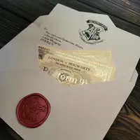 Лист запрошення до Гоґвортсу з квитками на поїзд