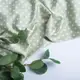 Ткань плательная атлас шелк Горошек белый на оливе