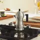 Гейзерная кофеварка 300 мл Alessi Pulcina на 6 чашек с черной ручкой