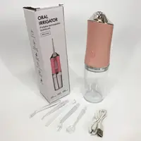 Ирригатор для чистки зубов и полости рта Oral Irrigator с аккумулятором и сменными насадками. Цвет: розовый