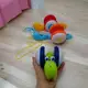 Каталка музыкальная "Веселая улитка", оранжевая